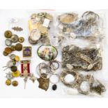 A collection of silver and white metal items,