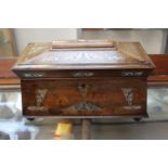 A Regency rosewood and mother of pearl inlaid sarcophagus shaped twin handled tea caddy,