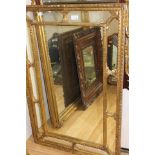 A rectangular gilt double edge framed wall mirror