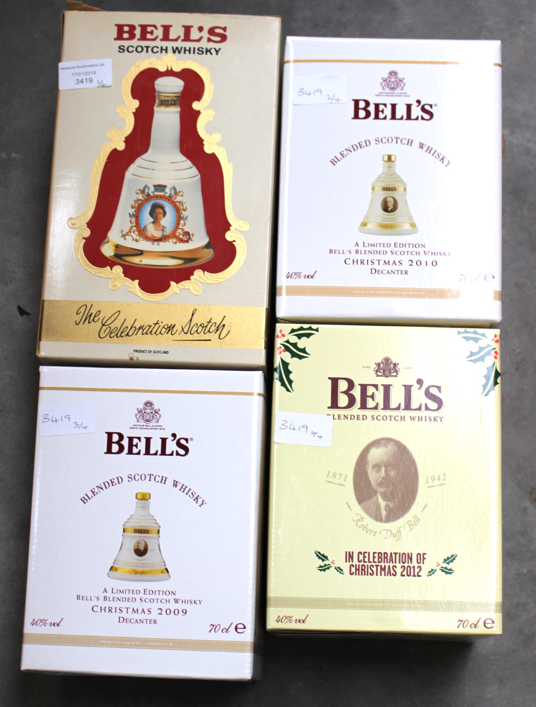 Four large Bells whiskey bells in 6 3/4 fl ounce commemorative decanters in boxes (4)