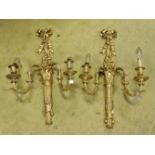 A pair of gilt metal twin branch wall lights in the Neo-classical taste,