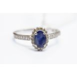 A sapphire and diamond cluster ring,