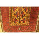 Persian red and amber ground rug