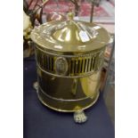 A 19th Century brass coal bucket, possibly circa 1810, with classical decoration,