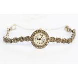 A ladies silver and marcasite cocktail watch, woven leaf style strap,