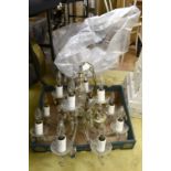 Twelve branch glass and yellow metal chandelier,