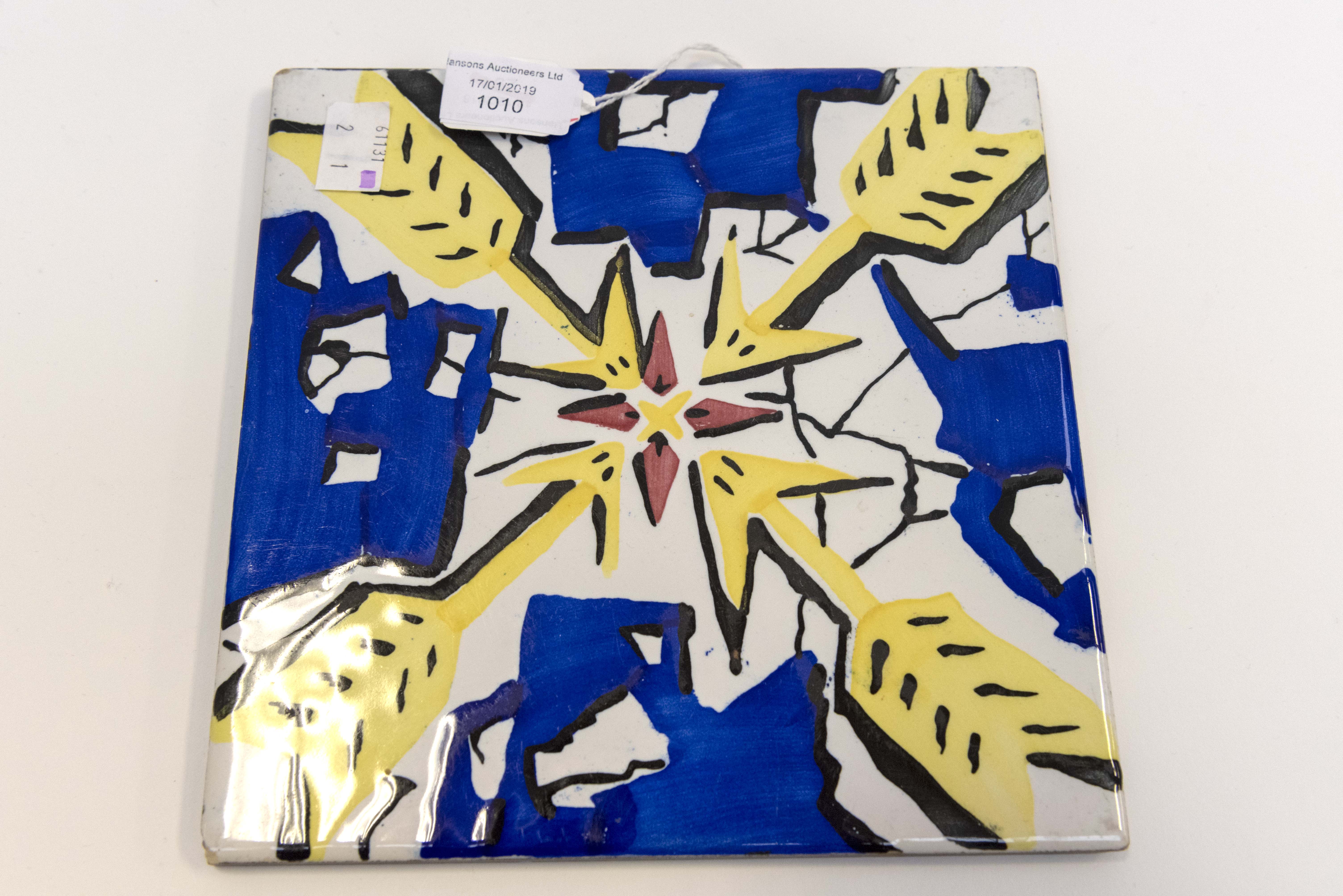 Salvador Dali (Spanish, 1904-1989), a ceramic tile with a stylized arrow design in blue and yellow,