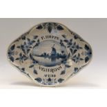 A Dutch Delft advertising quatrefoil tray, "P. Hoppe", Amsterdam, 1780 (S.