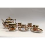 A Royal Crown Derby late 19th Century Birds Imari to include teapot (af) four coffee cups and