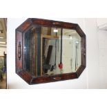 A 1920s oak oblong octagonal oak wall mirror,