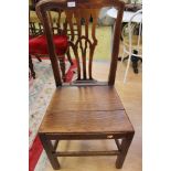 A George III joined elm side chair, in the manner of Thomas Chippendale, with a pierced back splat,