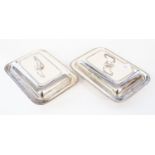 A pair of George V silver entree dishes, cover and handles, rectangular with gadroon edging,