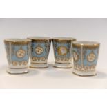 Four William Edwards blue and gold edged enamelled egg cups (4)