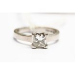 A diamond solitaire, the princess cut diamond weighing approx 0.