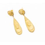 A pair of lava cameo and gold earrings, the carved oval cameo suspending a carved pear-shape cameo,