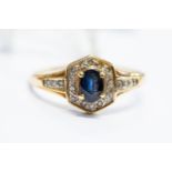 A sapphire and diamond dress ring, set to the centre with an oval sapphire,