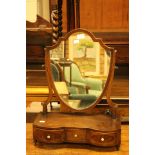 A Georgian mahogany shield shaped dressing table mirror,