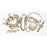 An interesting collection of silver jewellery, a key, an ingot, charm bracelet,