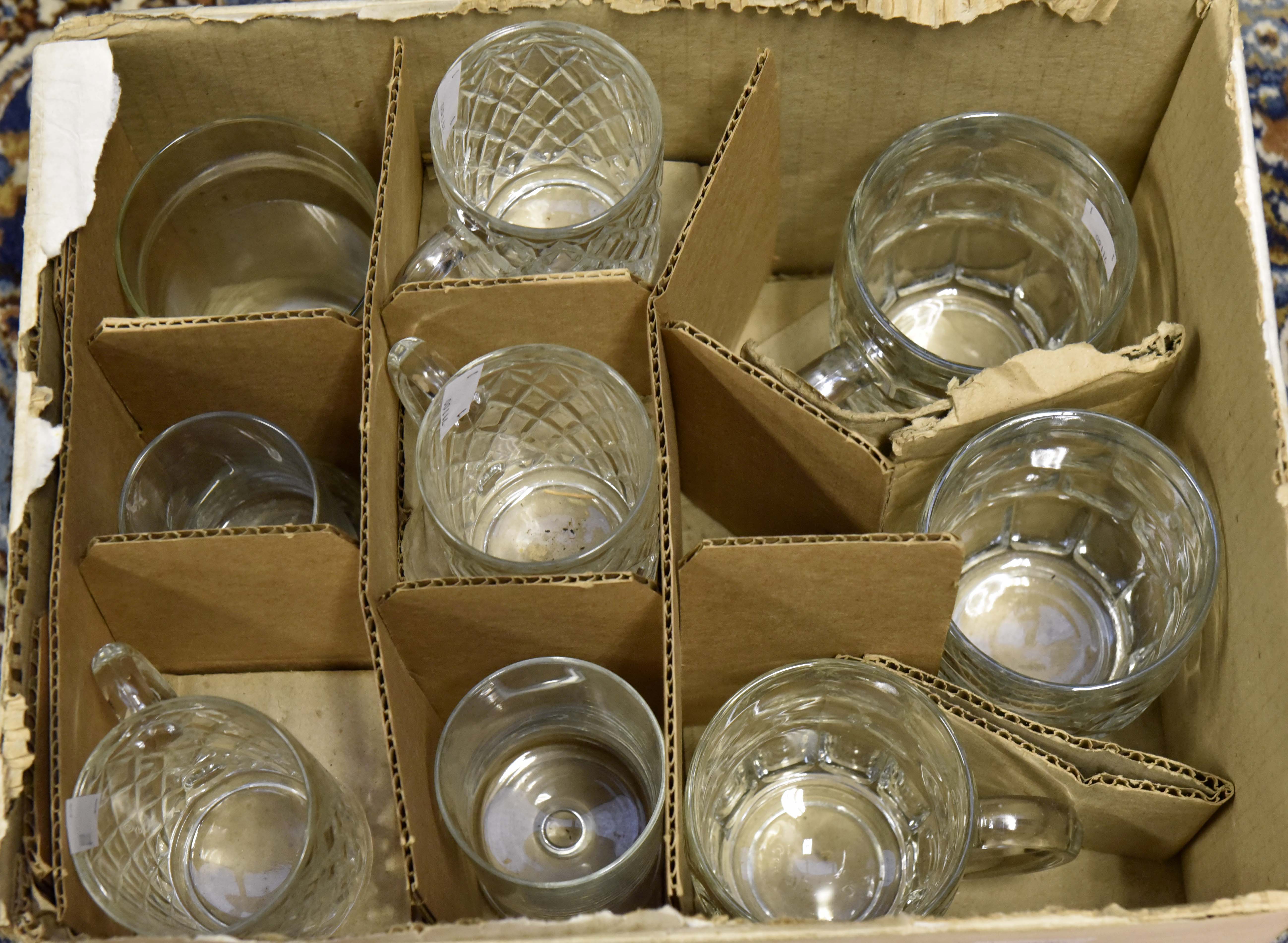 Collection of drinking glasses to include beer mugs, faceted glass mugs etc.