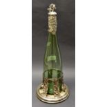 A 19th Century green glass decanter with stopper