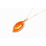 A 9ct gold fire opal coloured stone pendant, marquise shape with gold surround,