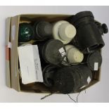 A box containing non-conducting ceramic and glass insulators for electric and telephone lines,
