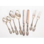 Collection of white metal embossed flatware, two knives, forks, spoons and teaspoons,