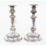 A pair of early 19th Century Old Sheffield plate telescopic candlesticks,