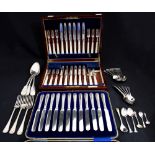 A collection of flatware including: A George V set of six silver and mother-of-pearl mounted fruit