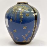 A Royal Doulton Art Deco shouldered vase decorated with wisteria and prunus flowers,