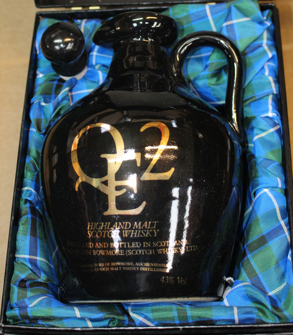 Rare Highland malt whiskey in Commemorative stoneware jug from RMS Elizabeth II in black display