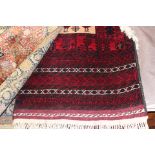 Deep red rug with central pattern of cockerals