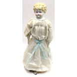 An unusual German china headed doll with golden hair,