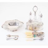 Late 19th Century 6 piece cut glass cruet set with pierced silver plated stand silver plated cake