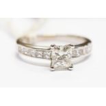 A diamond solitaire ring, the princess cut diamond weighing approx 1.