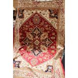 A contemporary machine made red ground Heriz carpet,