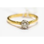 A diamond and 18ct gold ring, set with round brilliant cut diamond, approx diamond weight 0.