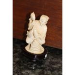 An early 20th Century Japanese carved Ivory figurine,