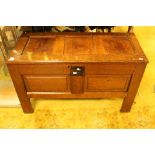 An 18th Century joined oak chest, fitted with candle box, two panels to front,