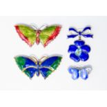 A collection of three enamelled brooches comprising an Art Nouveau silver and enamel butterfly