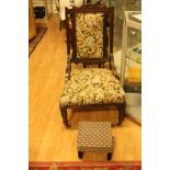 A late Victorian upholstered ladies chair and a footstool (2)