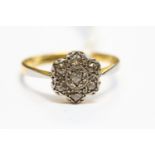 A diamond flower head cluster ring, set in 18ct gold, size O1/2,