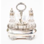 A George IV silver cruet stand, barge-shaped with a gadrooned and foliate decorated rim,