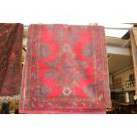 Red and green geometric pattern rug, hand knotted,