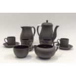 A Wedgwood black basalt coffee set, coffee pot, water jug, cream jug, sucrier,