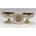 Pair of Cauldon Ltd floral painted twin handled squat shaped porcelain rose bowls, 13 cms high,
