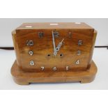 A 1930s veneered mantle clock,