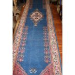 Long deep blue rug with geometric pattern