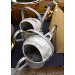 Two galvanized vintage watering cans