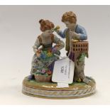 A Dresden Porcelain figurine group Boy with Bird and Young Girl